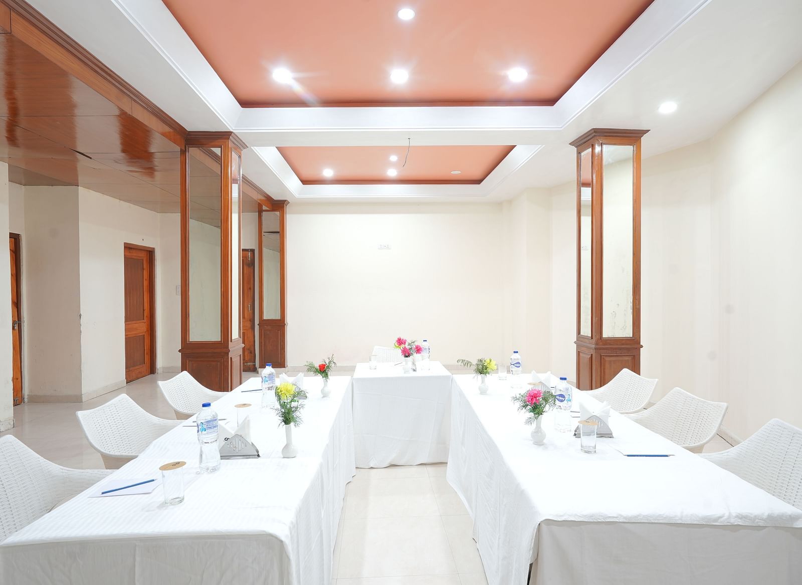 Conference hall with chairs and tables neatly arranged at DLS Hotels The Rock Castle.